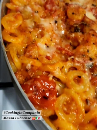 This! Comfort Food that makes your soul sing for more, every time ! Anelletti (small ring pasta) baked in the oven with little fried eggplant cubes, sweet, juicy chunks of Italian sausage, aromatic ripe tomato, and the oozy, cheesy, delicious SMOKED PROVOLA from our neighborhood dairy farm in Massa Lubrense. 🍅🐄🇮🇹 So good!... #cookingincampania #italianfood #comfortfood #pastaalforno  #ouredibleitaly